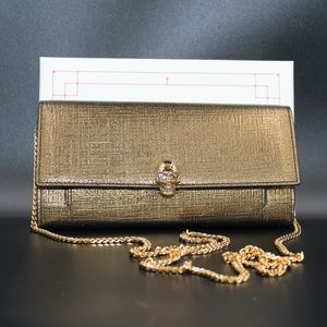 Alexander McQueen Skull Embossed Golden Clutch Bag
